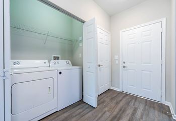 A laundry room with a washer and dryer.at Riverview Landing @ Valley Forge, Pennsylvania